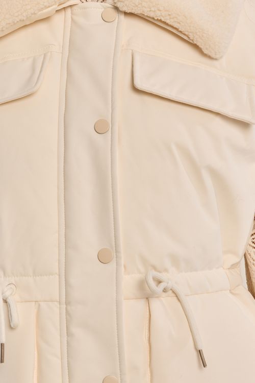 Quilted vest with a plush collar