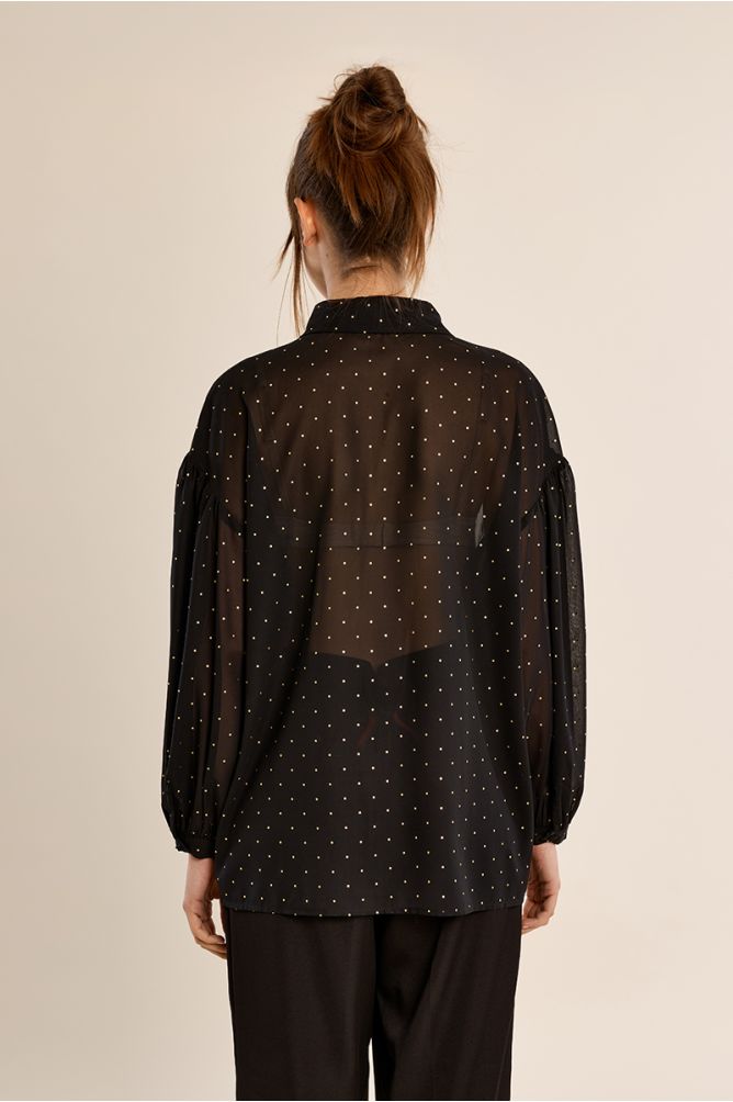 Blouse à pois en semi-transparence