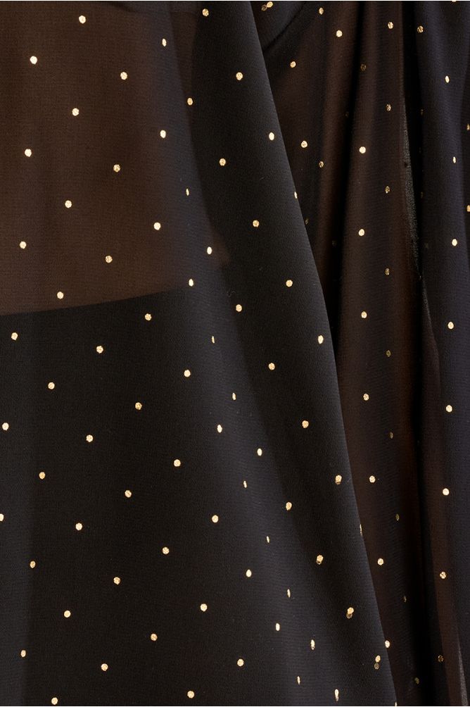 Blouse à pois en semi-transparence