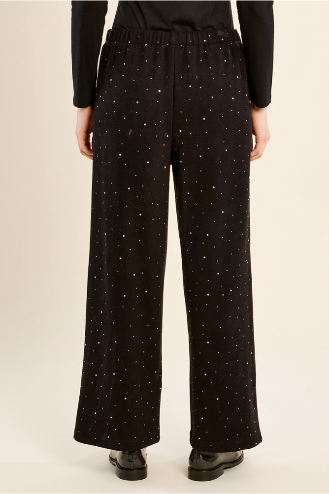 High-waisted trousers, studded with rhinestones
