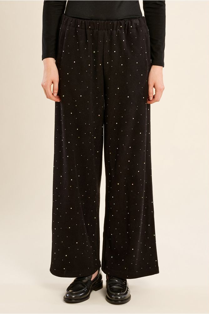 High-waisted trousers, studded with rhinestones