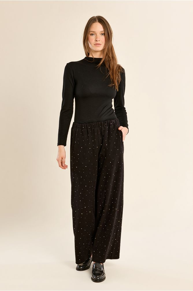 High-waisted trousers, studded with rhinestones