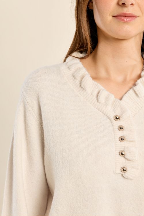 Knitted sweater with ruffled collar
