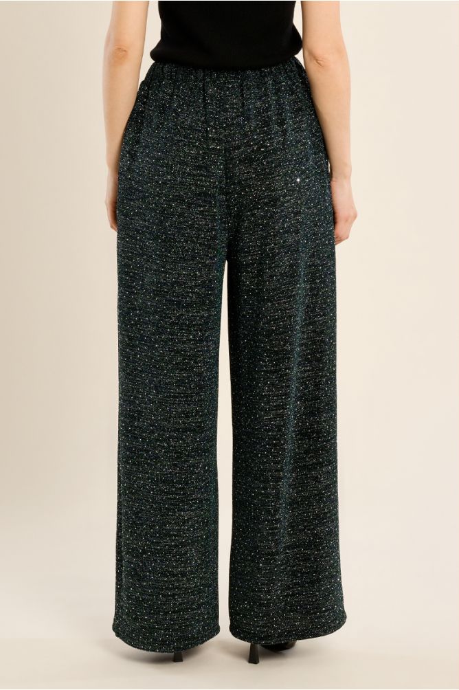 High-waisted trousers, studded with rhinestones