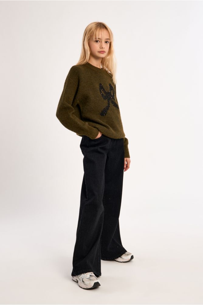 Pantalón vaquero con perneras anchas