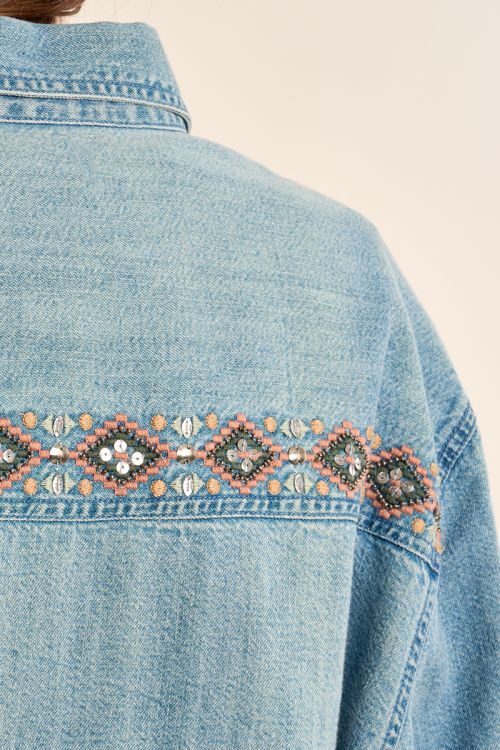 Denim shirt with bead detailing.