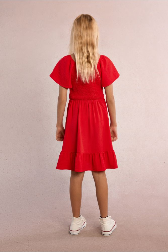Vestido de niña de manga corta mariposa y volante.