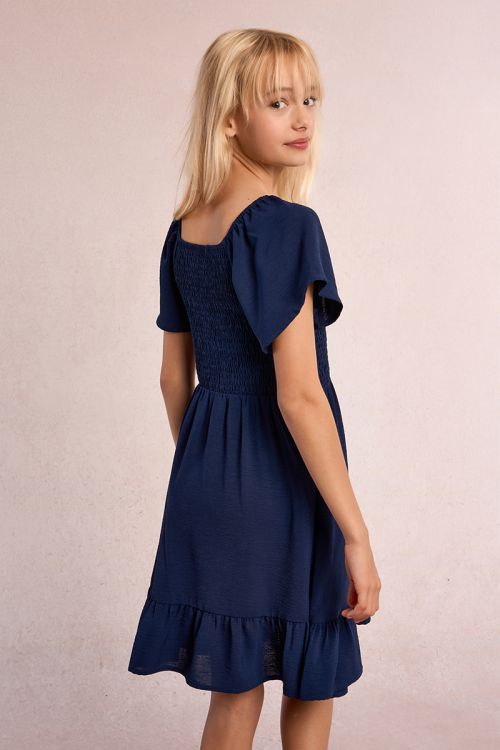 Vestido de niña de manga corta mariposa y volante.
