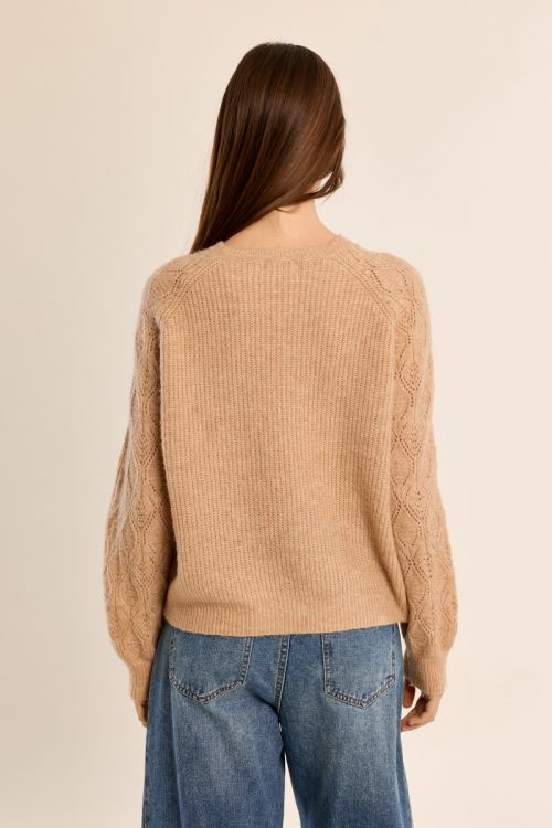 Knitted sweater with openwork sleeves