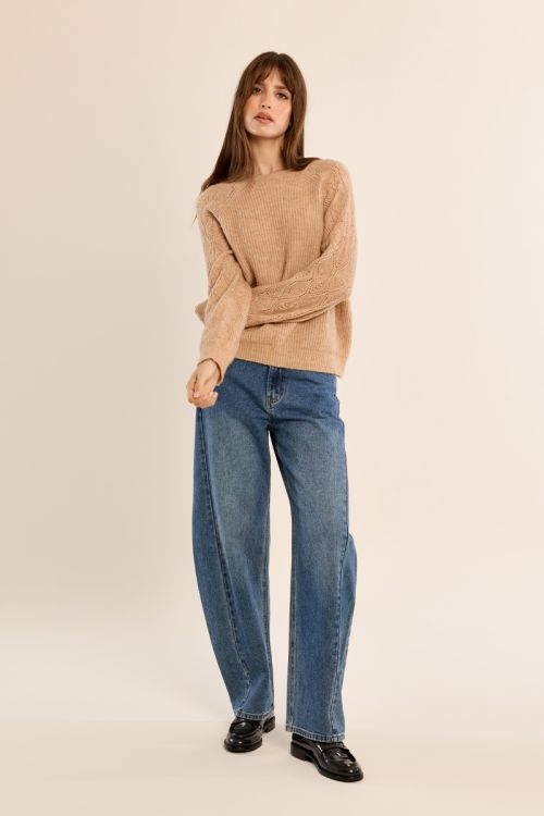 Knitted sweater with openwork sleeves