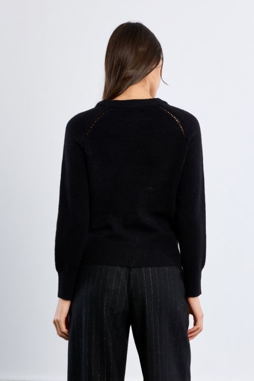 Knitted sweater, openwork embroidery and studs