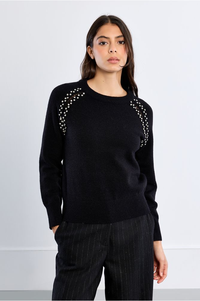 Knitted sweater, openwork embroidery and studs