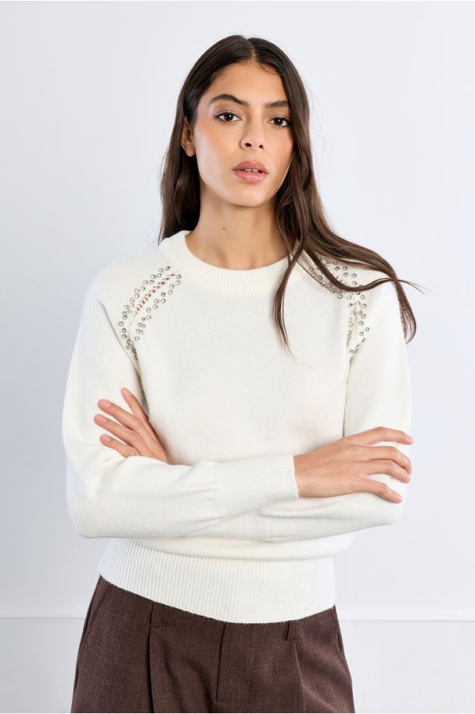 Knitted sweater, openwork embroidery and studs