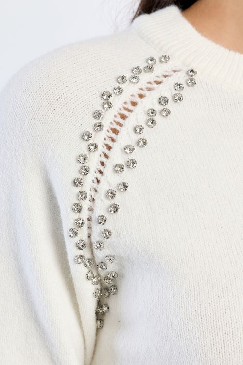 Knitted sweater, openwork embroidery and studs