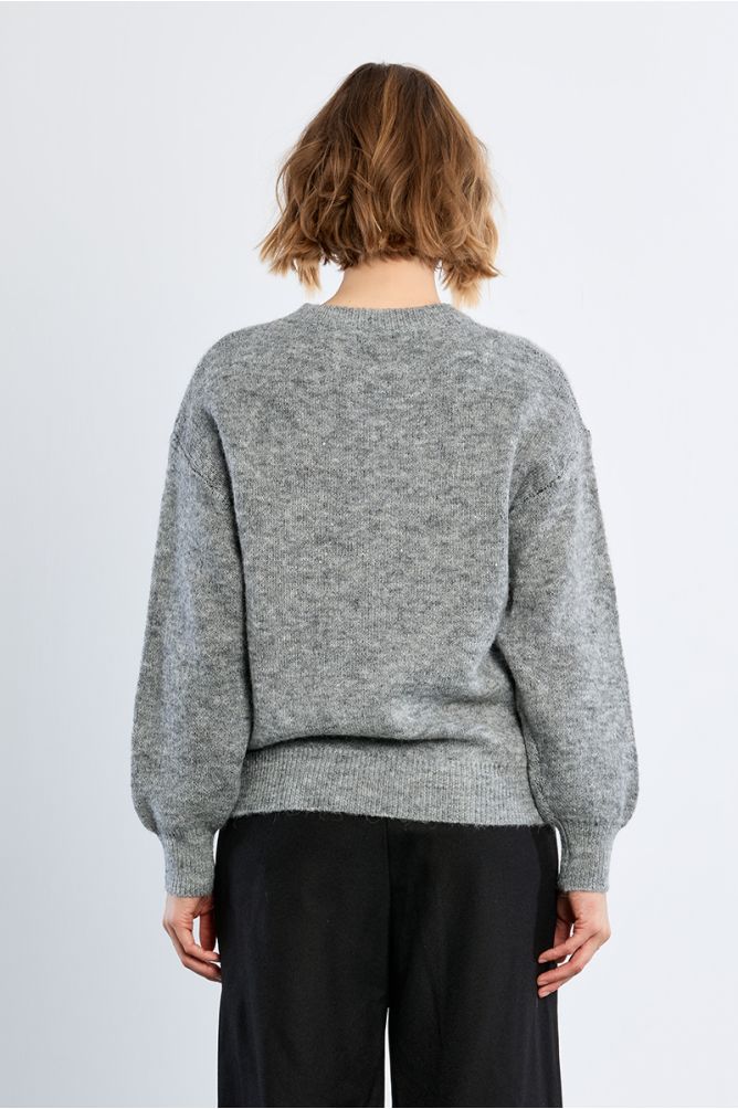 Knitted sweater, bow pattern