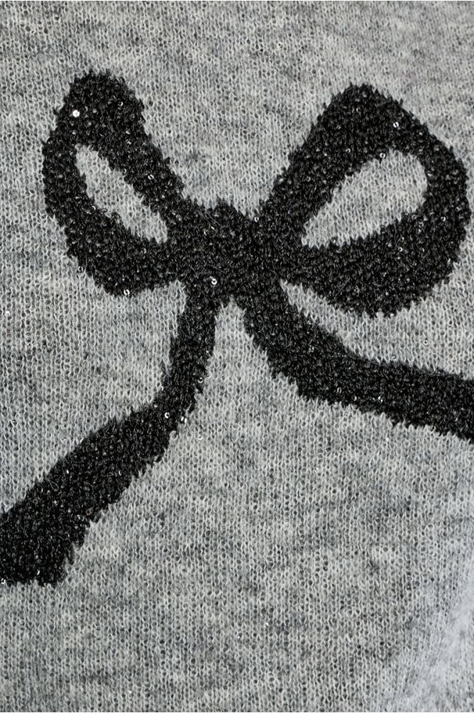 Knitted sweater, bow pattern