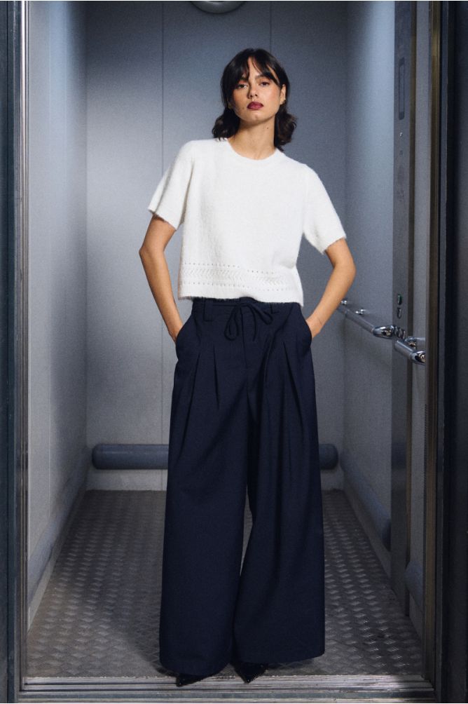 Baggy trousers, pleated