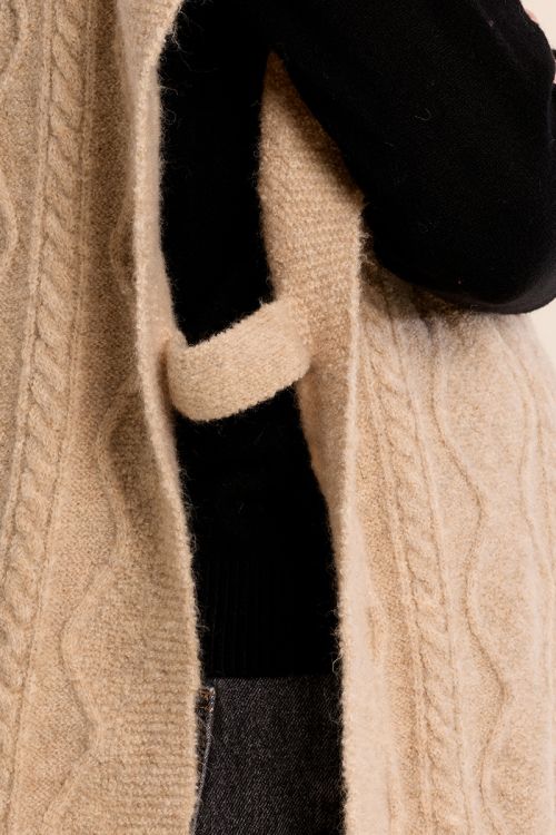 Poncho en maille torsadée