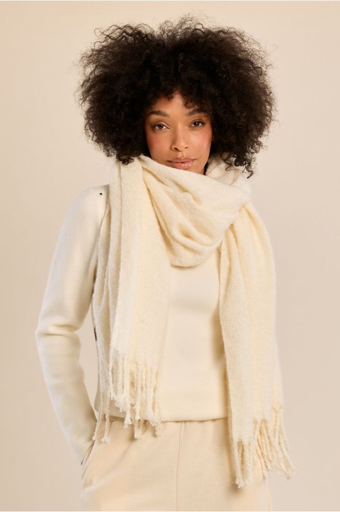 Knitted scarf, fringed